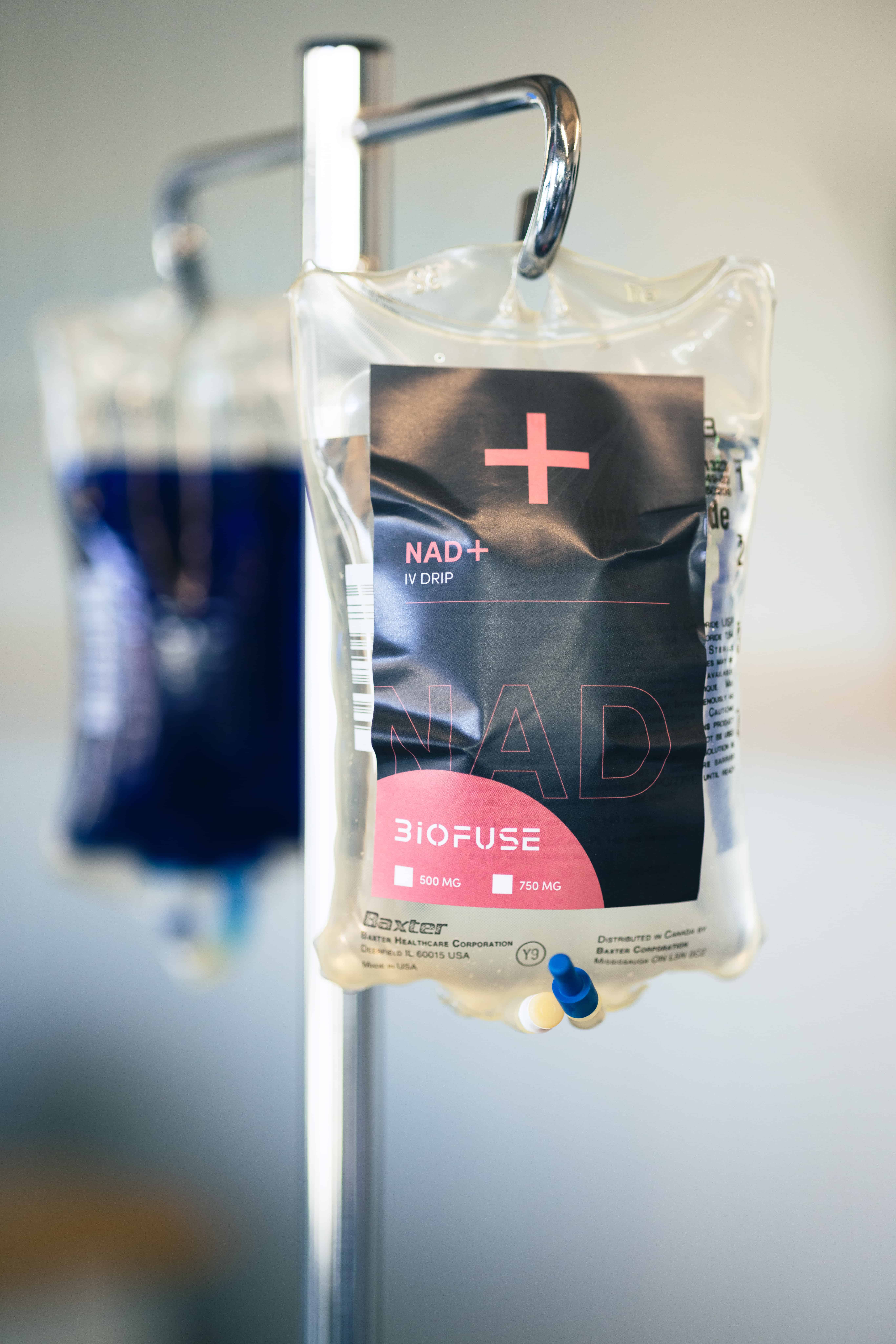 A bag of NAD+ IV solution hanging on a stand, clearly labeled, promoting the specialized treatment options available at Biofuse for enhanced cellular health.